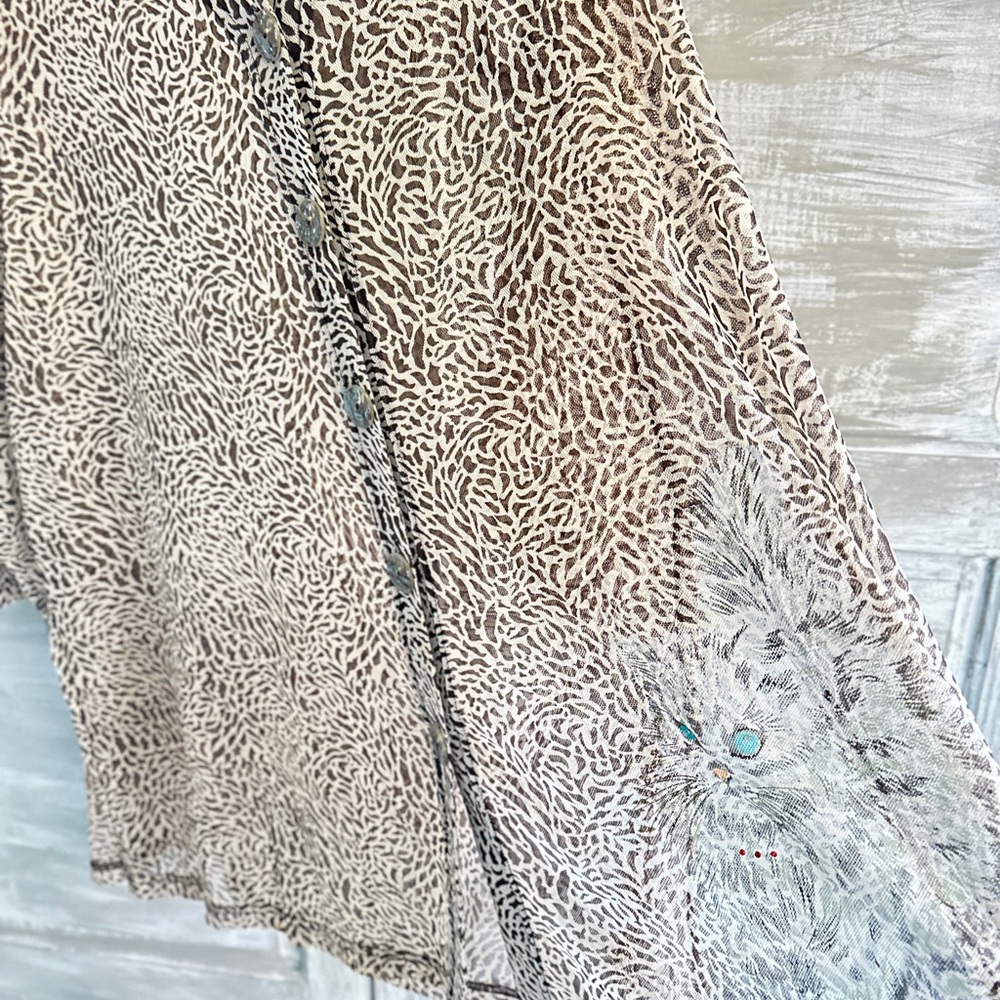 Animal Print Button-Up Blouse could be a cover-up for beach.